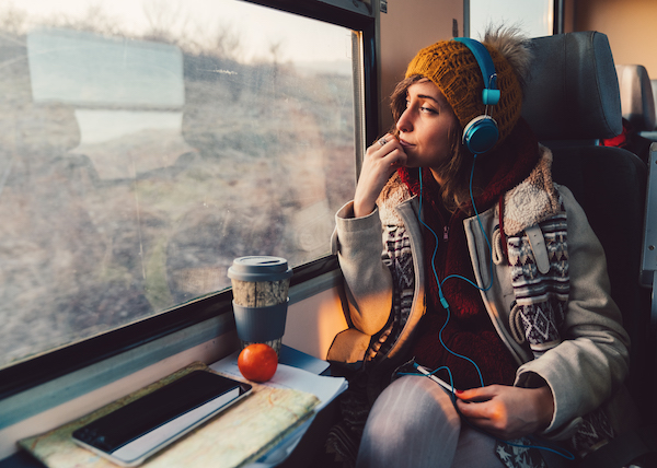 woman looking out window with gratitude in her heart