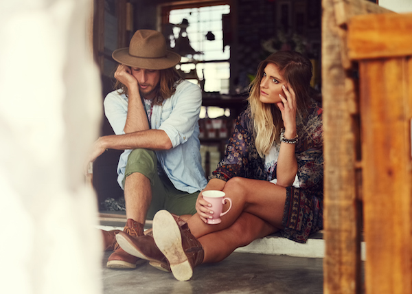 young couple contemplates whether or not they're in a relationship slump